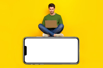 Aufkleber - Full length body size view of attractive focused guy using laptop sitting on copy space isolated over bright yellow color background