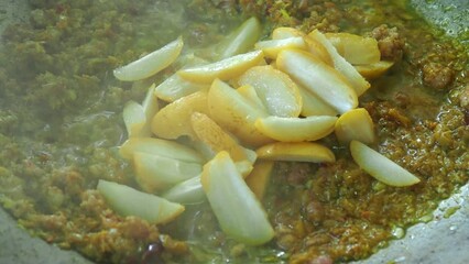 Wall Mural - Frying chili paste with chopped fresh dates in pan, in door  Chiangmai  Thailand