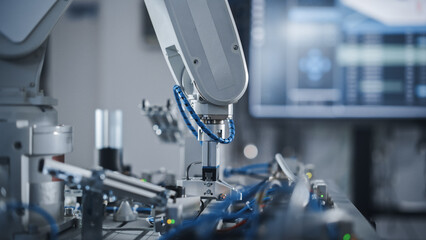Poster - Industry 4.0 Modern Factory: Programmed Robot Arm Moving at Different Sides. Production Line Machine at Empty room.No people, Close Up View. Automated Robotics Concept