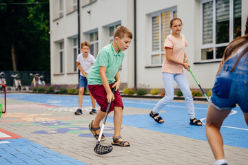 Children playing street hockey on a city holiday