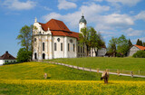 The Pilgrimage Church of Wies (German: Wieskirche) is an oval rococo church in the Bavarian Alps on a sunny day in May (Steingaden, Weilheim-Schongau district, Bavaria, Germany)