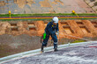 © chitsanupong - Male worker inspection wearing safety first harness rope safety line working at a high place on tank roof spherical gas