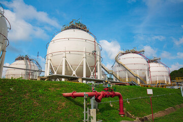 Wall Mural - White spherical propane tanks containing fuel gas industry
