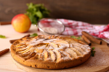 Wall Mural - Appetizing pie close-up on a wooden background