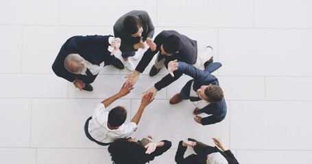 Aufkleber - A high five between a group of business people cheering, celebrating and working as a team from above. Teamwork with a colleague or coworker leading to success is welcome in a startup company