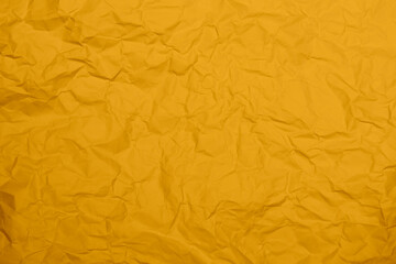 Wall Mural - Closeup yellow crumpled paper texture background. Yellow wrinkled paper texture background. Yellow crease fabric texture background. Yellow wrinkled fabric texture background.