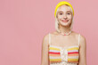 © ViDi Studio - Young smiling fun happy attractive blond lesbian woman 20s she wear colorful knitted top yellow hat look camera isolated on plain pastel light pink background. People lgbtq lifestyle fashion concept.