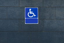 Accessibility Sign On Gray Wall