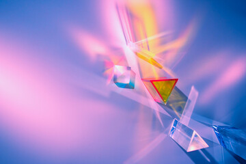 Wall Mural - Glass prisms and cubes with color spectrum rays. Abstract background with reflection and refraction of light. Shadow and rays of natural light effects..