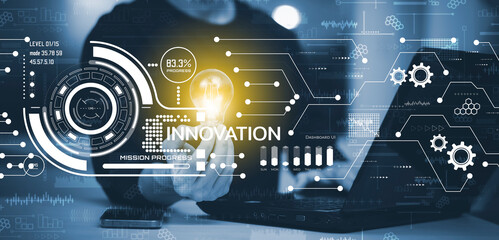 Businessman holding glowing light bulb with Innovation with Graphical User Interface Concept, Innovative ideas presented by management consultants on-screen, design, invention development