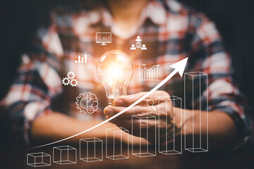 Poster - Businessman holding light bulbs, new ideas with of Stock market or forex trading graph and candlestick chart suitable for financial investment, Economy trends background for business idea stock.