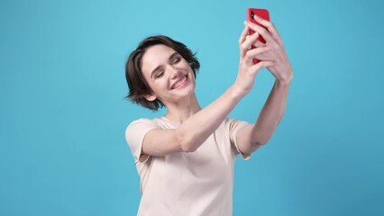 Poster - Lady making selfie portrait gadget isolated on blue color background