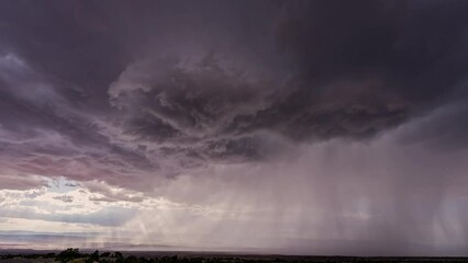 Wall Mural - Dark clouds rotating in the sky in front of monsoon storm in Utah moving through the desert.