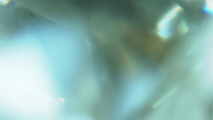 Wall Mural - Sun Glare in Marine Colors. Loop. The light passes through the facets of a slowly rotating diamond and creates repetitive sparkling highlights and rainbow colors