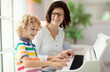 © famveldman - Child playing piano. Kids play music.