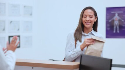 Canvas Print - Patient buying medicine from pharmacist at the pharmacy or drug store using medical aid. Customer getting doctor prescription medication at the chemist. Lady asks for professional healthcare advise