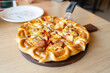 Tasty, flavorful pizza with Mozzarella cheese, sausage, tomato sauce, Margherita, mushroom on wooden background