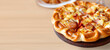 Tasty, flavorful pizza with Mozzarella cheese, sausage, tomato sauce, Margherita, mushroom on wooden background