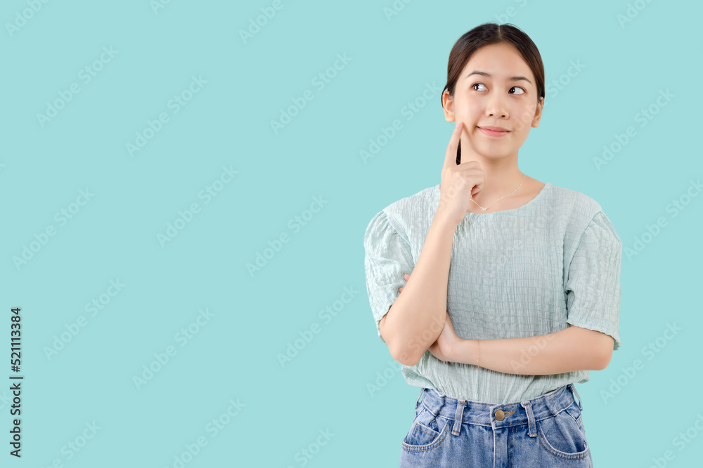 Pretty young Asian girl thinking and looking upwards. The concept of ...
