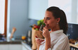 © lenets_tan - Happy woman drinking tea in the kitchen at home