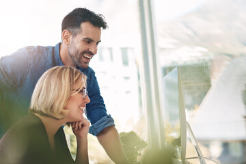 Aufkleber - Teamwork and unity of two colleagues and coworkers working together on a computer in the office. Businessman and woman talking, discussing and planning in a meeting for brainstorming ideas at work