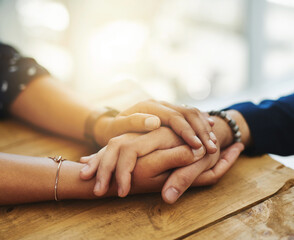 Holding hands showing care, love and support between friends, couple or family. People comforting, giving affection and embracing friendship with a hand gesture and touch during a difficult time