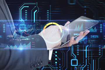 Poster - businessman hand pointing at tablet with high-tech sensor circuit board panel hologram with business chart. Technology, finance and digital communication concept on dark background. Double exposure.