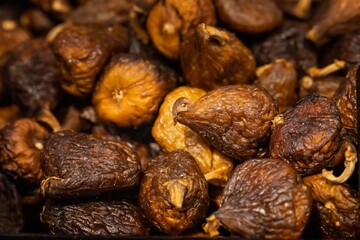 Background of dried fig in a street market in Greece, concept gastronomy, selective focus on the fig in the center of the image.