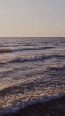 Wall Mural - Large foamy waves at high tide, drone video