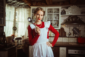 Housewife preparing a meal in the kitchen, 50s retro style 