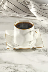 Wall Mural - Fresh hot coffee cup and marble desk  