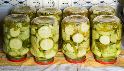 Canned vegetable marrow in glass jars during home canning