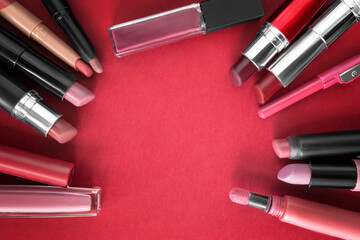 Poster - Lipsticks on red background