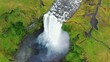 drone circling to the right over Skogafoss waterfall in Iceland in 4k60