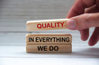 Quality in everything we do text on wooden blocks. Quality control concept