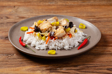 Wall Mural - Chinese style cod, served on a plate with white rice.