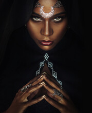 Fantasy Portrait African American Sexy Woman Queen Priestess Of Night. Tiara Crown Silver Moon Hood On Head. Creative Black Design. Voodoo Witch Gothic Girl Sexy Looks Into Camera. Halloween Costume.