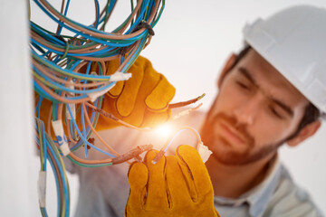 Poster - Electrician working with cable on the construction site,House and house reconstruction,Repairing light at home,repair work.