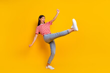 Full Size Portrait Of Ecstatic Glad Girl Raise Leg Have Good Mood Dancing Isolated On Yellow Color Background