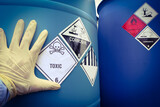 Fototapeta Maki - Warning symbol for chemical hazard on chemical container