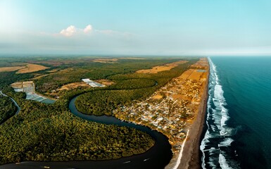 Poster - High-angle view of a beautiful river flowing in the forest in El Paredon, Guatemala