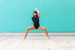 © ADDICTIVE STOCK - Asian ballerina doing plie squat on street