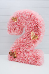 Wall Mural - pink number 2 made of cardboard and paper for a holiday, birthday decorations