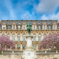 Wall Mural - Paris, the facade of the Hotel de Ville, with cherry trees