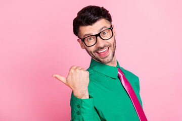 Sticker - Closeup side profile photo of young guy wear glasses pointing empty space advertisement isolated on pink color background