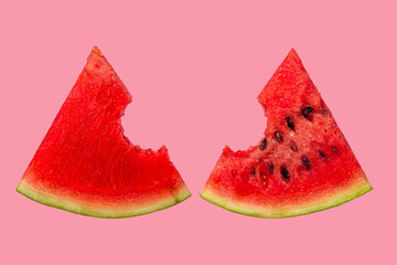 Wall Mural - Slices of watermelon on a pink background. Bitten slice of watermelon