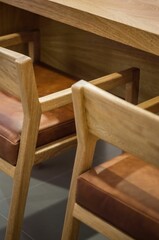 Vertical high-angle view of simple furniture - two wooden chairs and a table