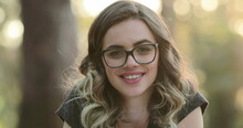 Beautiful Hispanic Student Girl Smiling To Camera. Portrait Of Happy Latina Young Woman Wearing Glasses Looking To Viewer