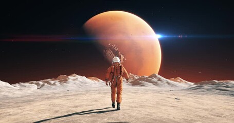 Wall Mural - male astronaut in space suit walking on alien planet. planet mars is visible. space related slow mot
