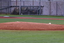Empty baseball pitchers mound with a white rosin bag
